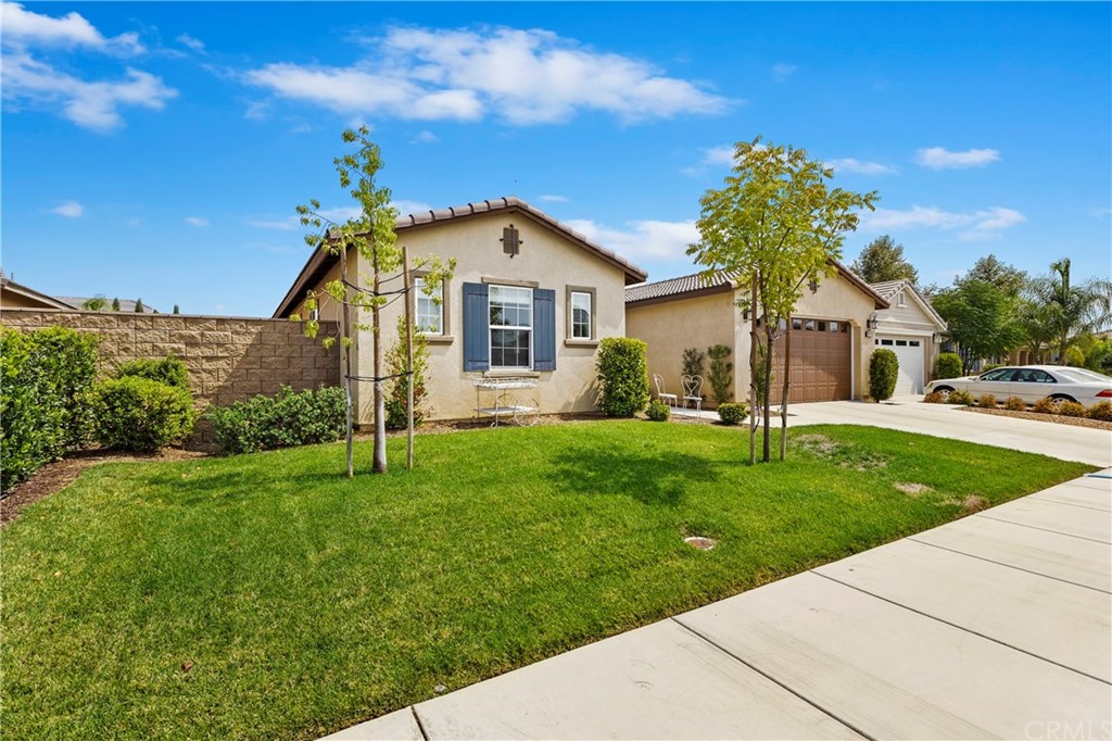 28212 Rustling Wind Circle Menifee, CA 92585 - Photo 2 of 28 a front view of a house with a yard