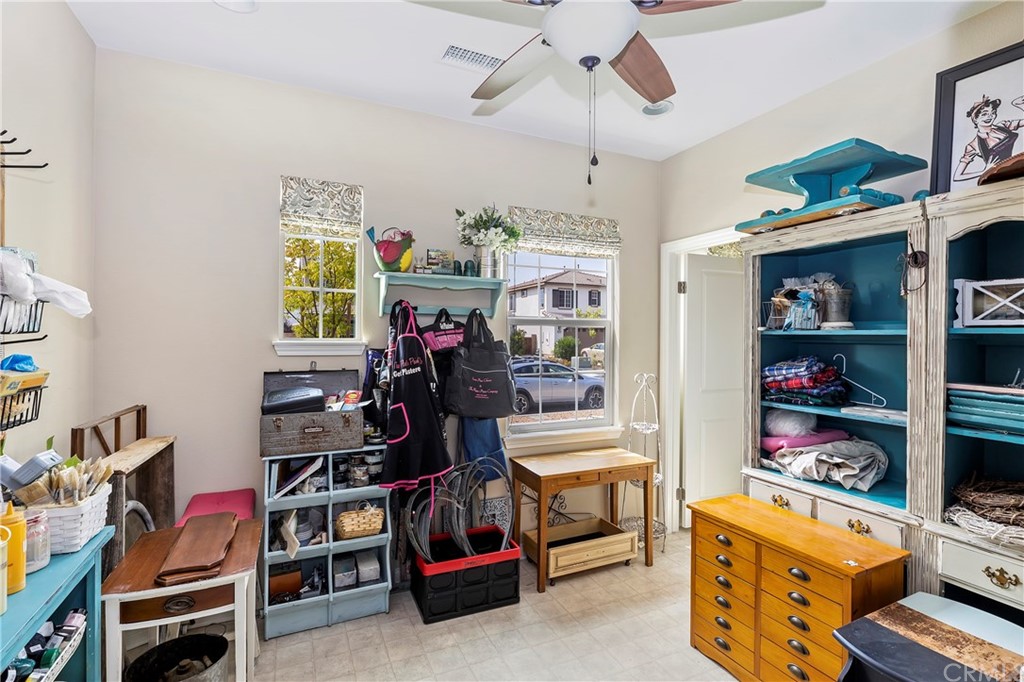 28212 Rustling Wind Circle Menifee, CA 92585 - Photo 23 of 28 a view of a workspace with furniture and toys