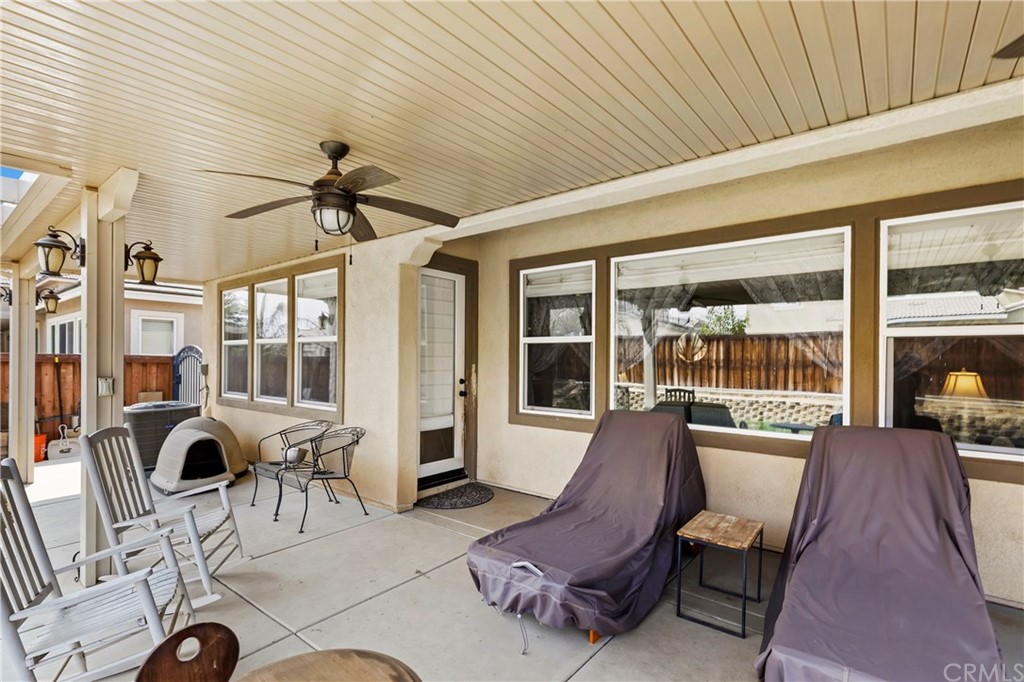28212 Rustling Wind Circle Menifee, CA 92585 - Photo 25 of 28 a view of a livingroom with furniture and floor to ceiling window