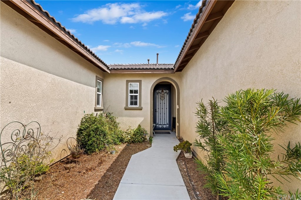 28212 Rustling Wind Circle Menifee, CA 92585 - Photo 4 of 28 a front view of a house with garden