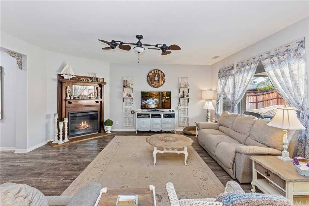28212 Rustling Wind Circle Menifee, CA 92585 - Photo 7 of 28 a living room with furniture a window and a flat screen tv