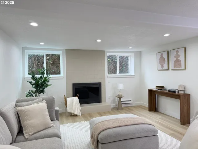 a living room with furniture and a fireplace