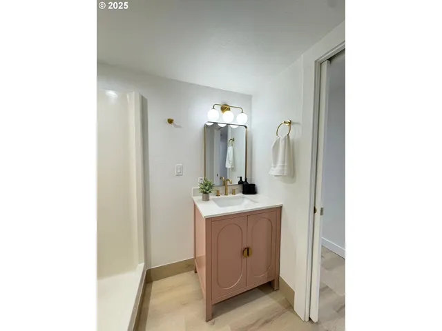 a bathroom with a double vanity sink and mirror