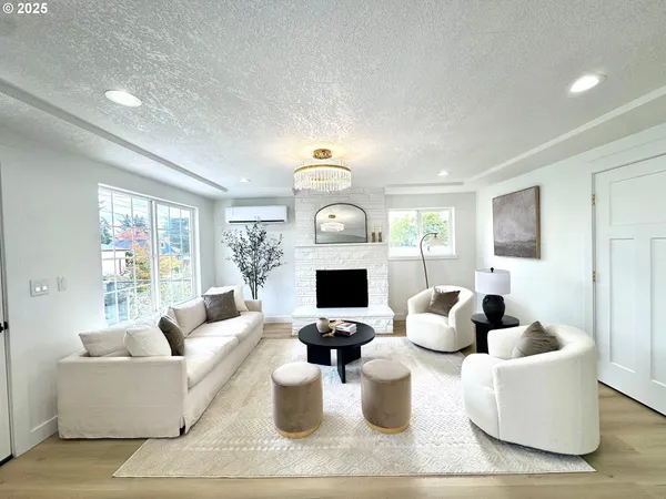 a living room with fireplace furniture and a flat screen tv
