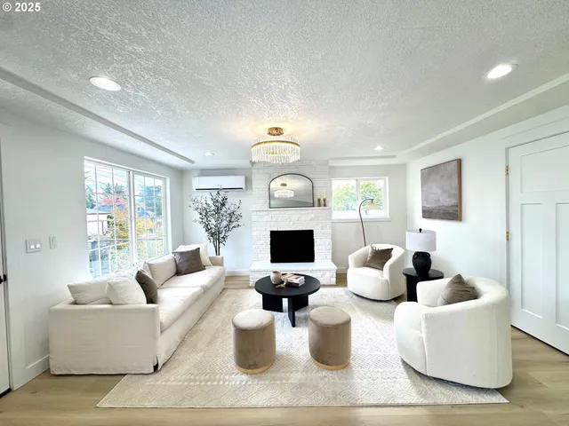 a living room with fireplace furniture and a flat screen tv