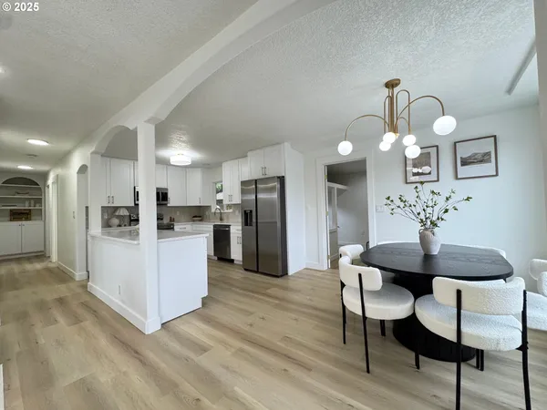 a view of kitchen with furniture and wooden floor