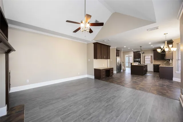 a view of a kitchen with a microwave and a stove