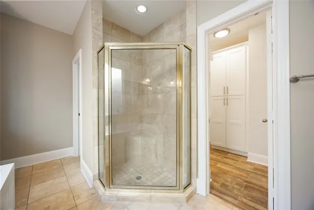 a bathroom with a glass shower door