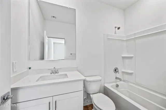a bathroom with a sink toilet and bathtub