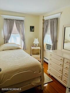 214 Howe Street Point Pleasant, NJ 08742 - Photo 14 of 16 a bedroom with a bed and a window