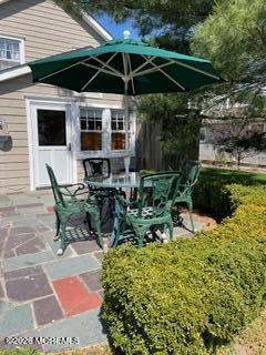 214 Howe Street Point Pleasant, NJ 08742 - Photo 16 of 16 a view of backyard with outdoor seating and plants