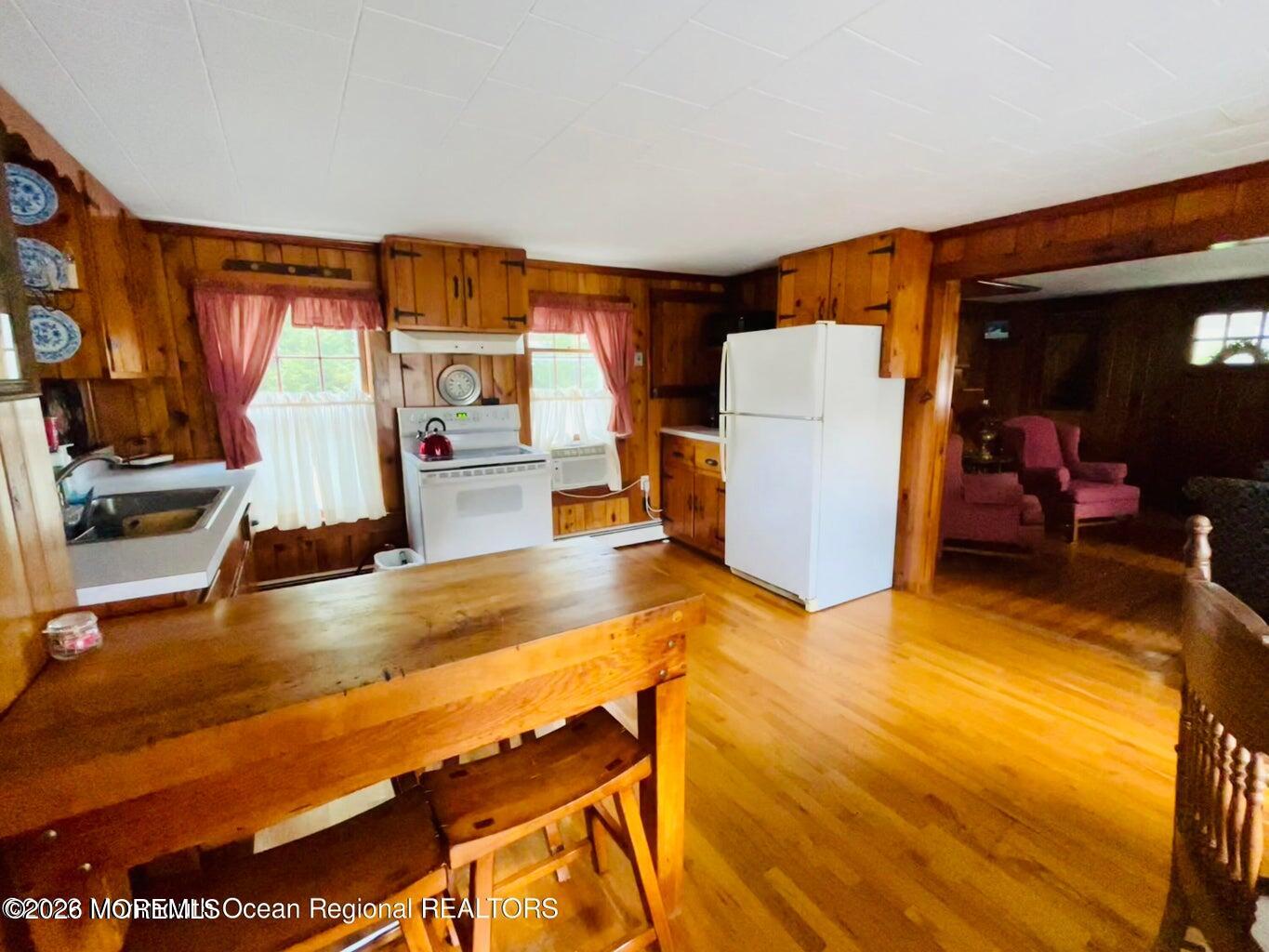 214 Howe Street Point Pleasant, NJ 08742 - Photo 8 of 16 a view of a room with furniture and kitchen view