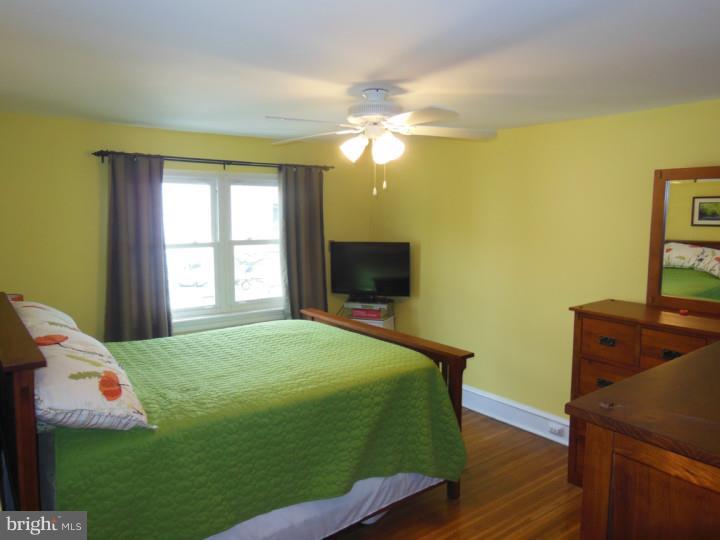 241 Richfield Road Upper Darby, PA 19082 - Photo 15 of 24 a bedroom with a bed and a flat screen tv
