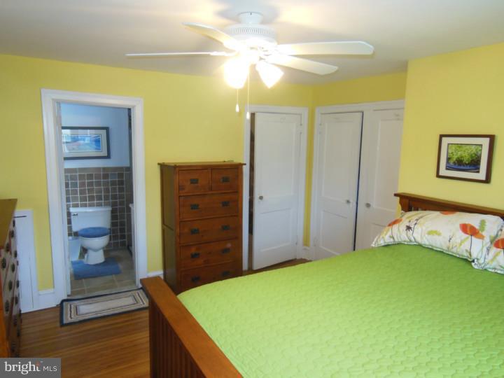 241 Richfield Road Upper Darby, PA 19082 - Photo 16 of 24 a bedroom with a bed and a table