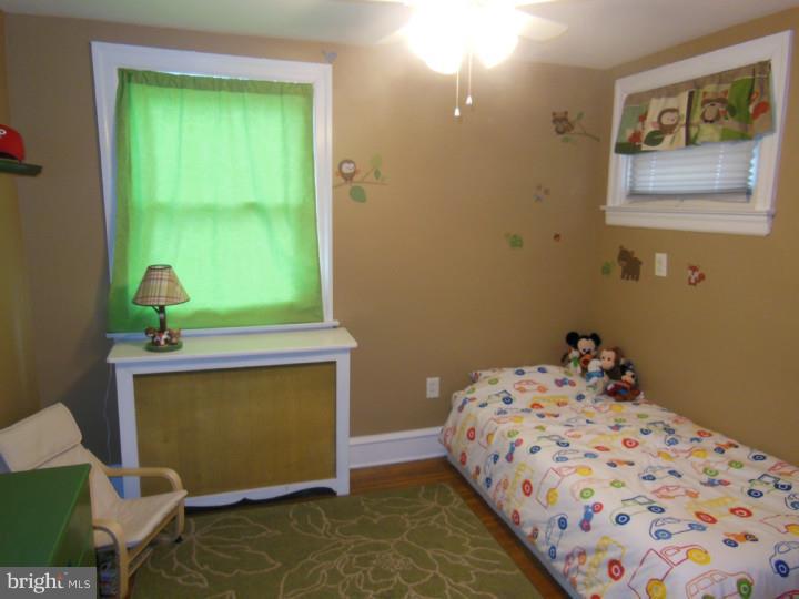 241 Richfield Road Upper Darby, PA 19082 - Photo 19 of 24 a bedroom with a bed and a window