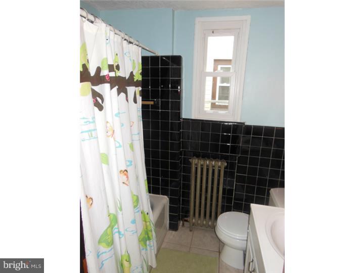 241 Richfield Road Upper Darby, PA 19082 - Photo 22 of 24 a bathroom with a sink toilet and shower