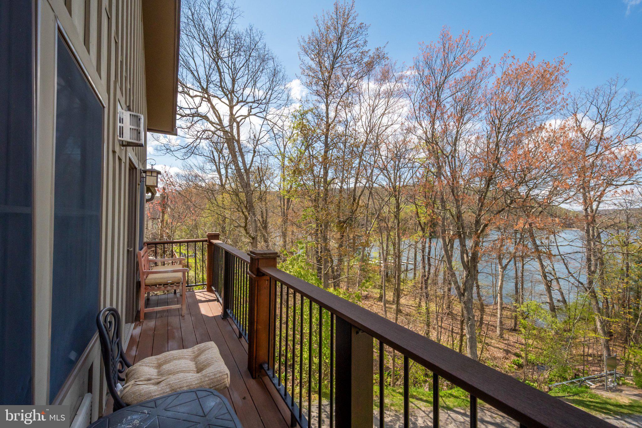 565 Glendale Road, Unit 303B Oakland, MD 21550 - Photo 21 of 34 a view of balcony with wooden floor and fence