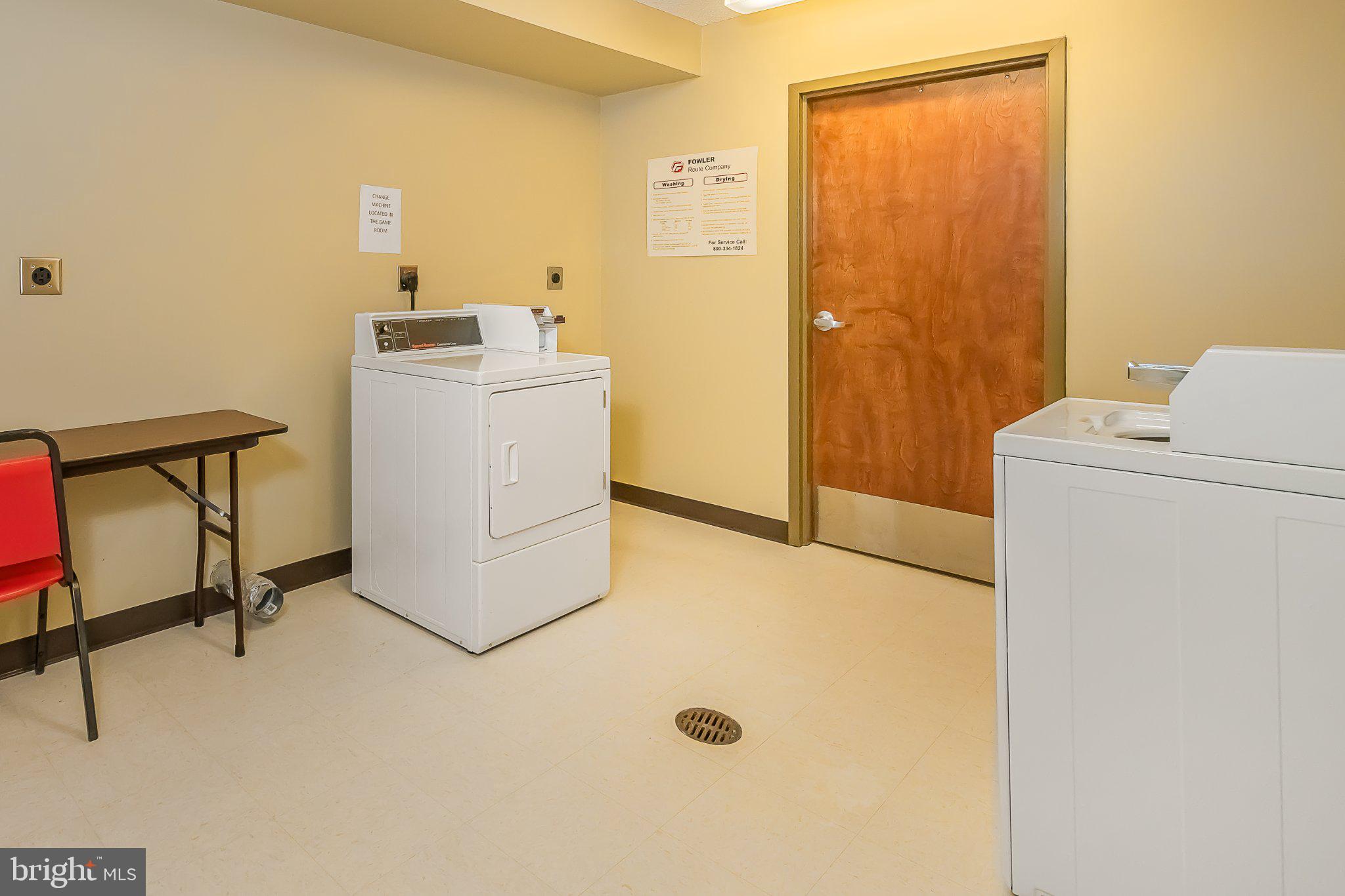 565 Glendale Road, Unit 303B Oakland, MD 21550 - Photo 29 of 34 a utility room with a refrigerator a washer and dryer