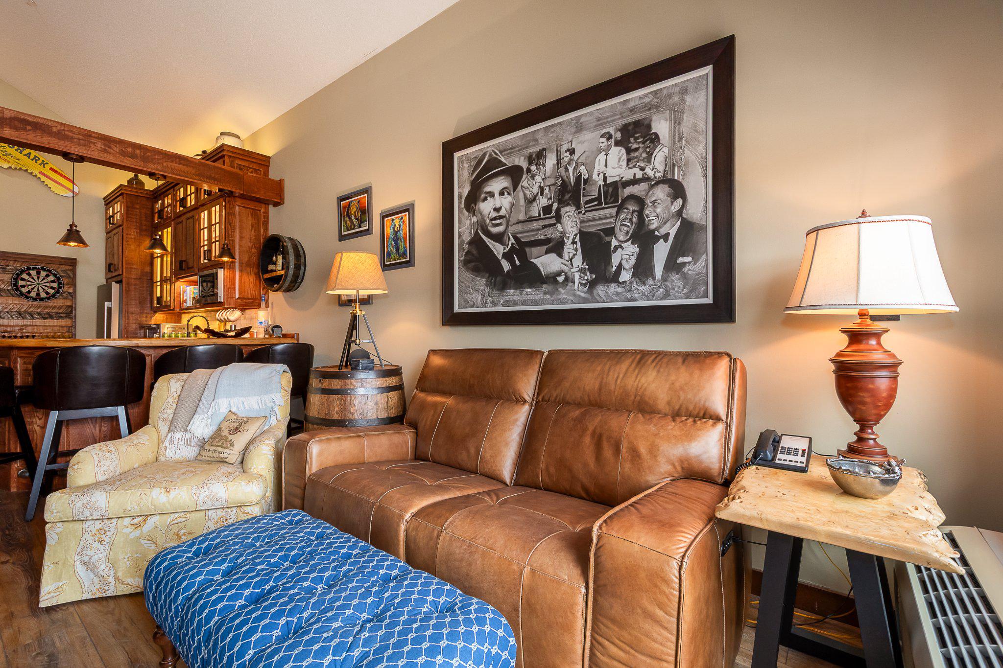565 Glendale Road, Unit 303B Oakland, MD 21550 - Photo 6 of 34 a living room with furniture and a painting on the wall