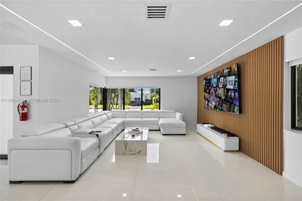 a living room with furniture and a rug