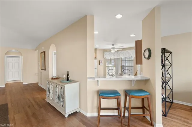 a view of kitchen with furniture and wooden floor