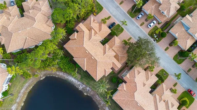 an aerial view of a house with a yard and garden