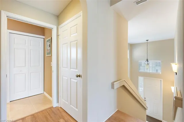 a view of a bathroom from a hallway
