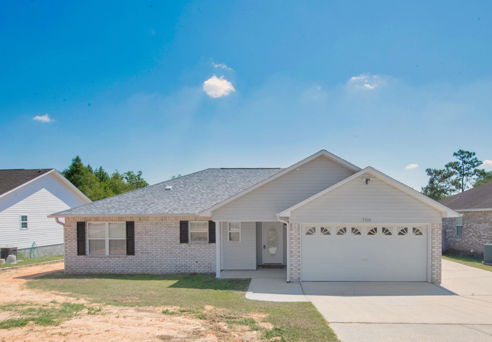 706 Riva Ridge Drive Crestview, FL 32539 - Photo 1 of 22 a view of a house with a yard