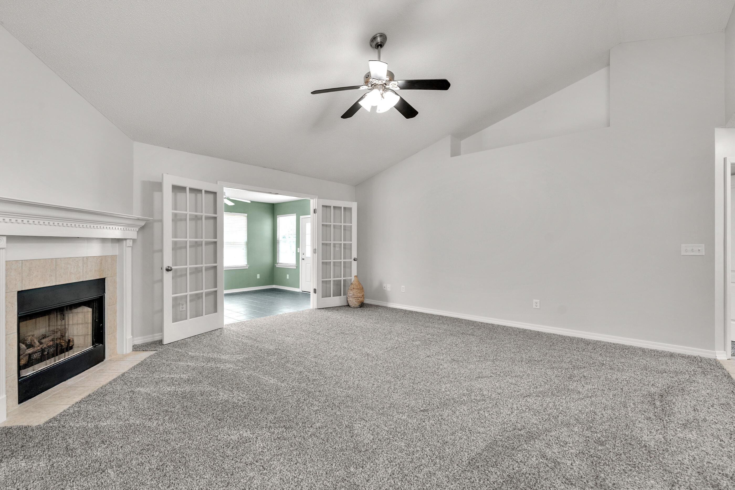 706 Riva Ridge Drive Crestview, FL 32539 - Photo 4 of 22 a view of empty room with fireplace and fan