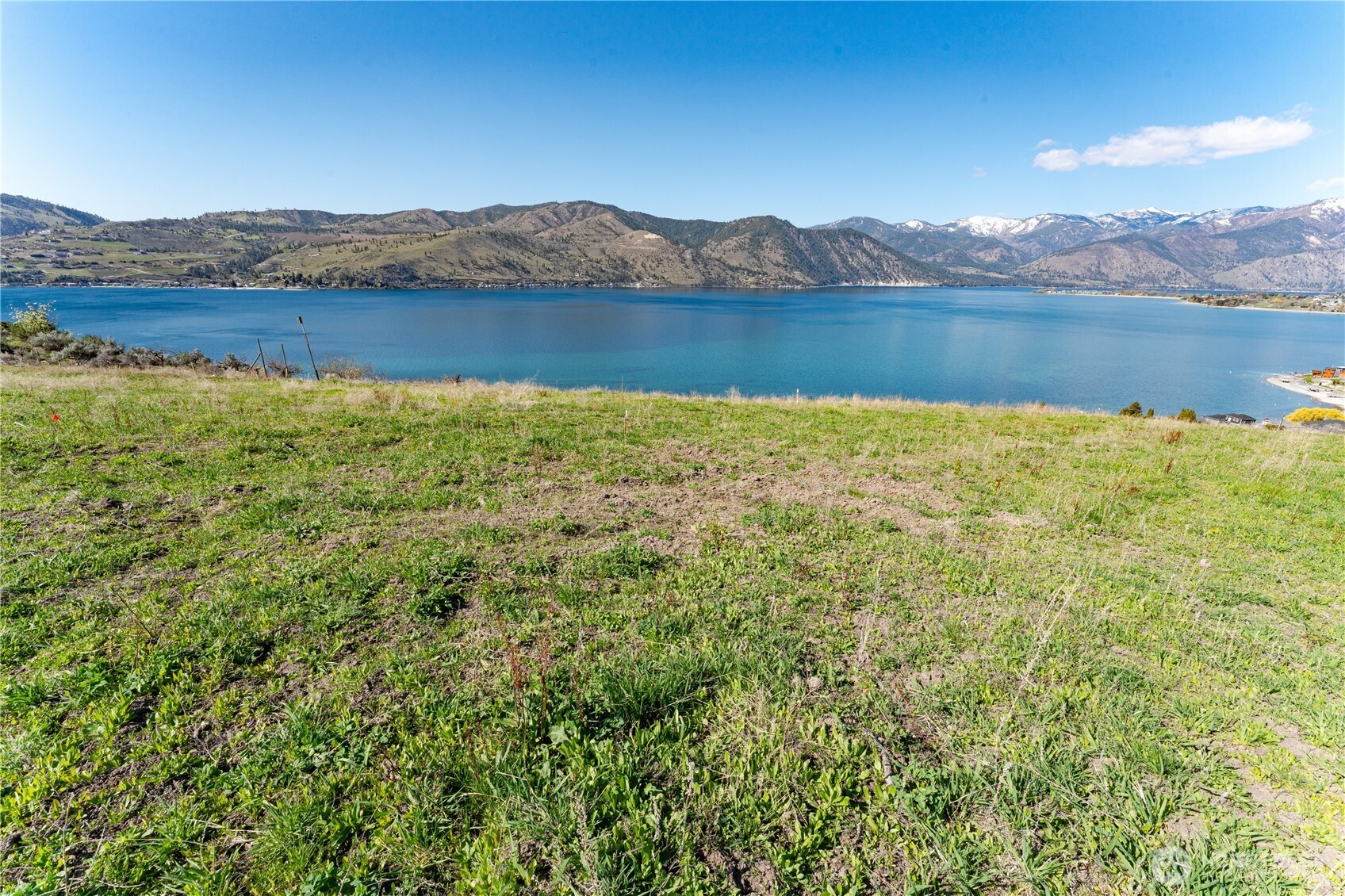 -nna Nna Makai Road Manson, WA 98831 - Photo 1 of 15 a view of an lake with a mountain in the background