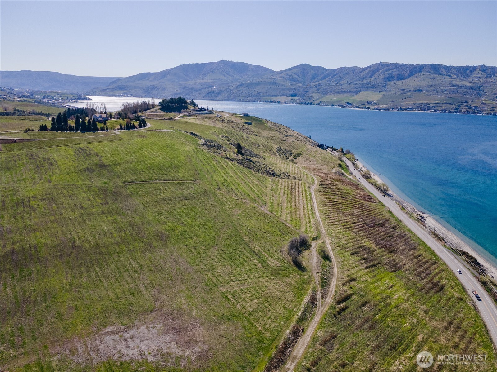 -nna Nna Makai Road Manson, WA 98831 - Photo 11 of 15 a view of a lush green hillside and houses