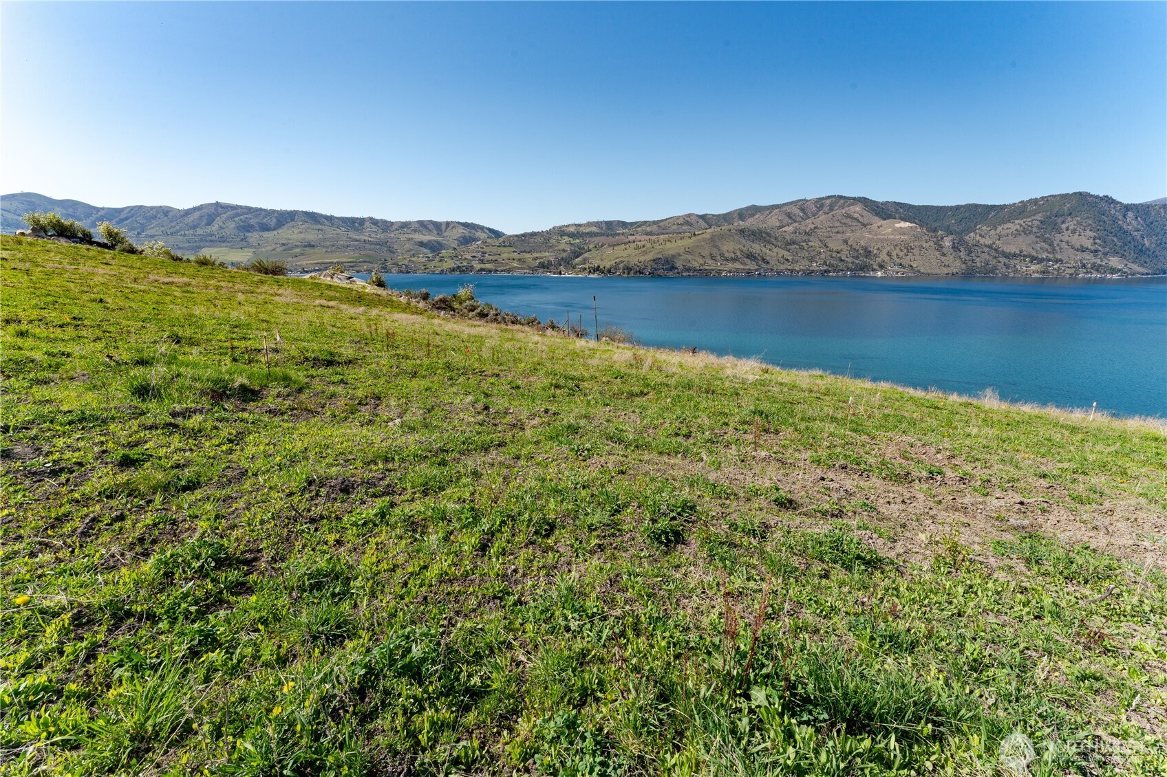 -nna Nna Makai Road Manson, WA 98831 - Photo 7 of 15 a view of a lake with a mountain in the background