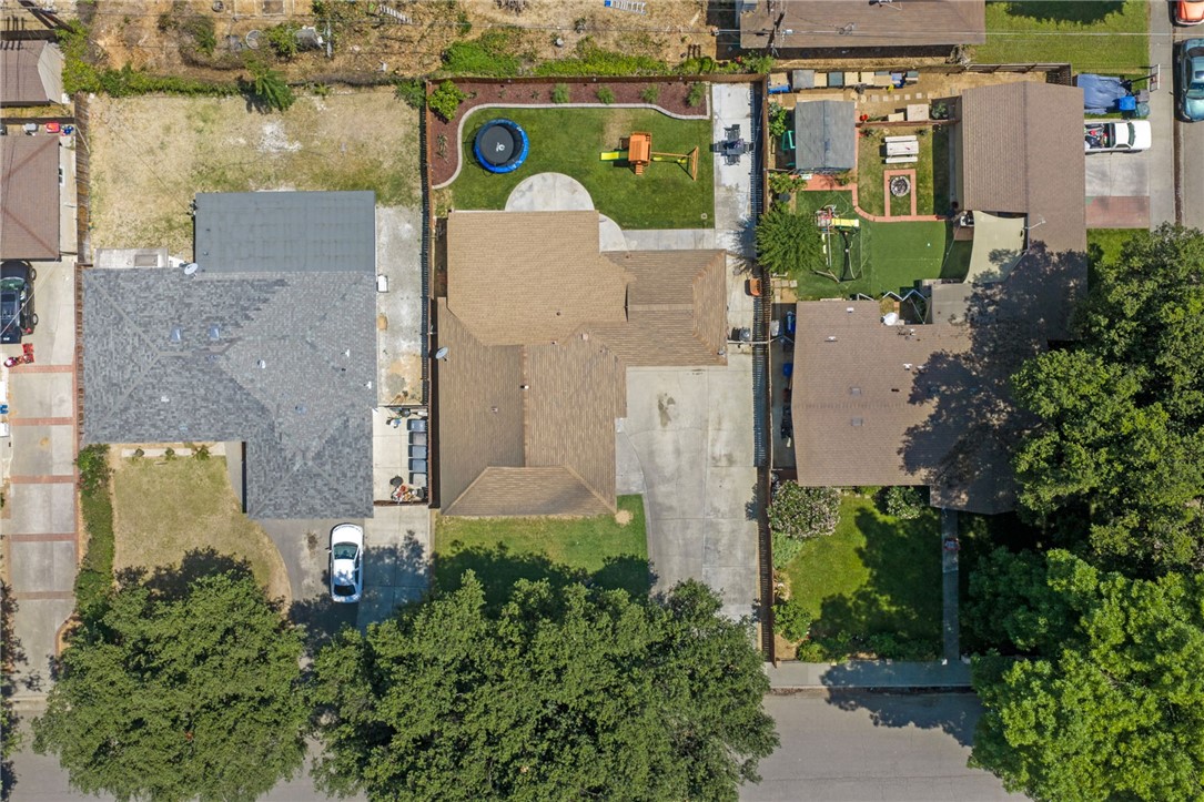 4869 Serrano Place Riverside, CA 92504 - Photo 7 of 40 Aerial view highlighting the sizable lot, large driveway, private backyard, and usable outdoor areas.
