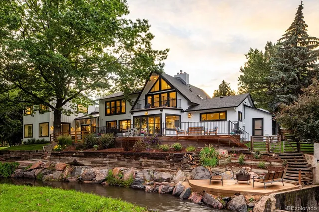 a front view of a house with sitting area