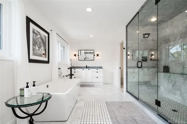 a bathroom with a bathtub and a shower