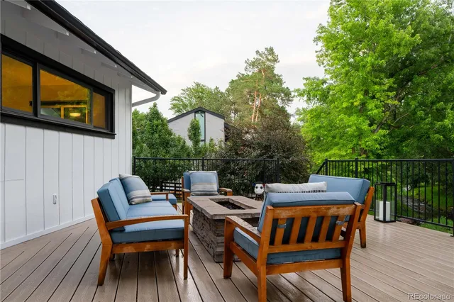 a view of a wooden deck with furniture