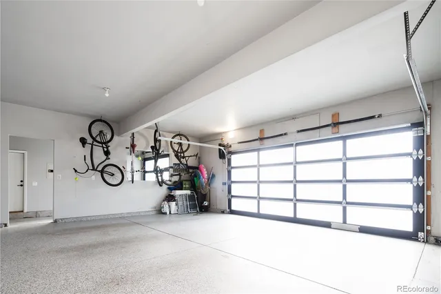 a view of empty room with window and couch