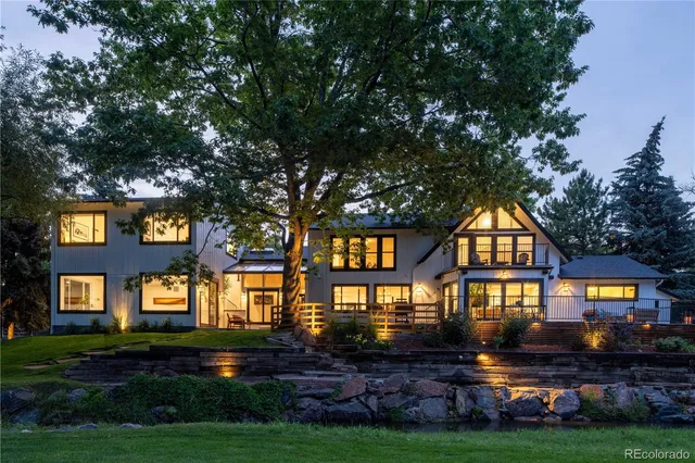 a view of a big yard and large trees