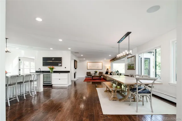 a living room with stainless steel appliances kitchen island granite countertop furniture and a kitchen view