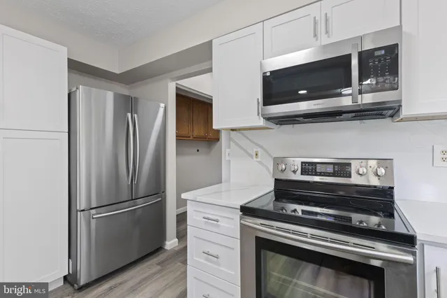 a bathroom with a toilet a sink and a mirror