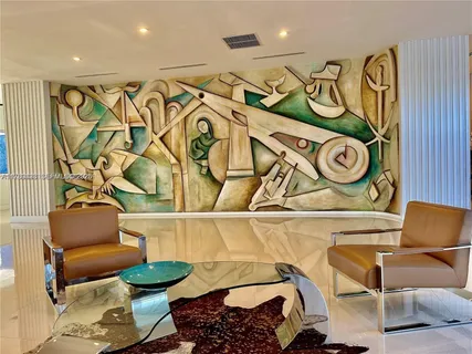 a kitchen with a refrigerator and a potted plant