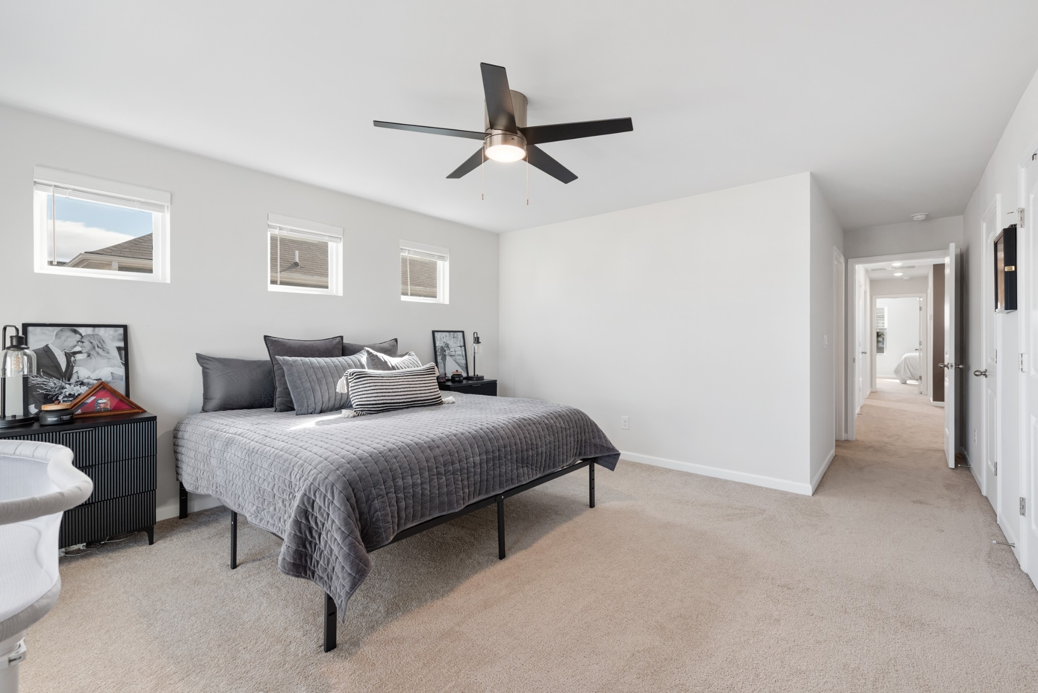 1406 Ashfield Place Lebanon, TN 37087 - Photo 11 of 23 a bedroom with a bed and a chandelier