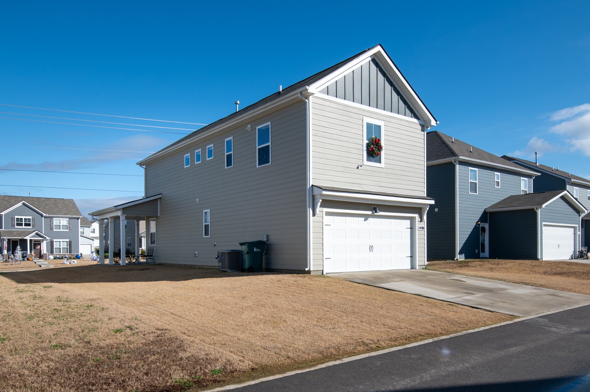 1406 Ashfield Place Lebanon, TN 37087 - Photo 3 of 23 a front view of a house with a yard