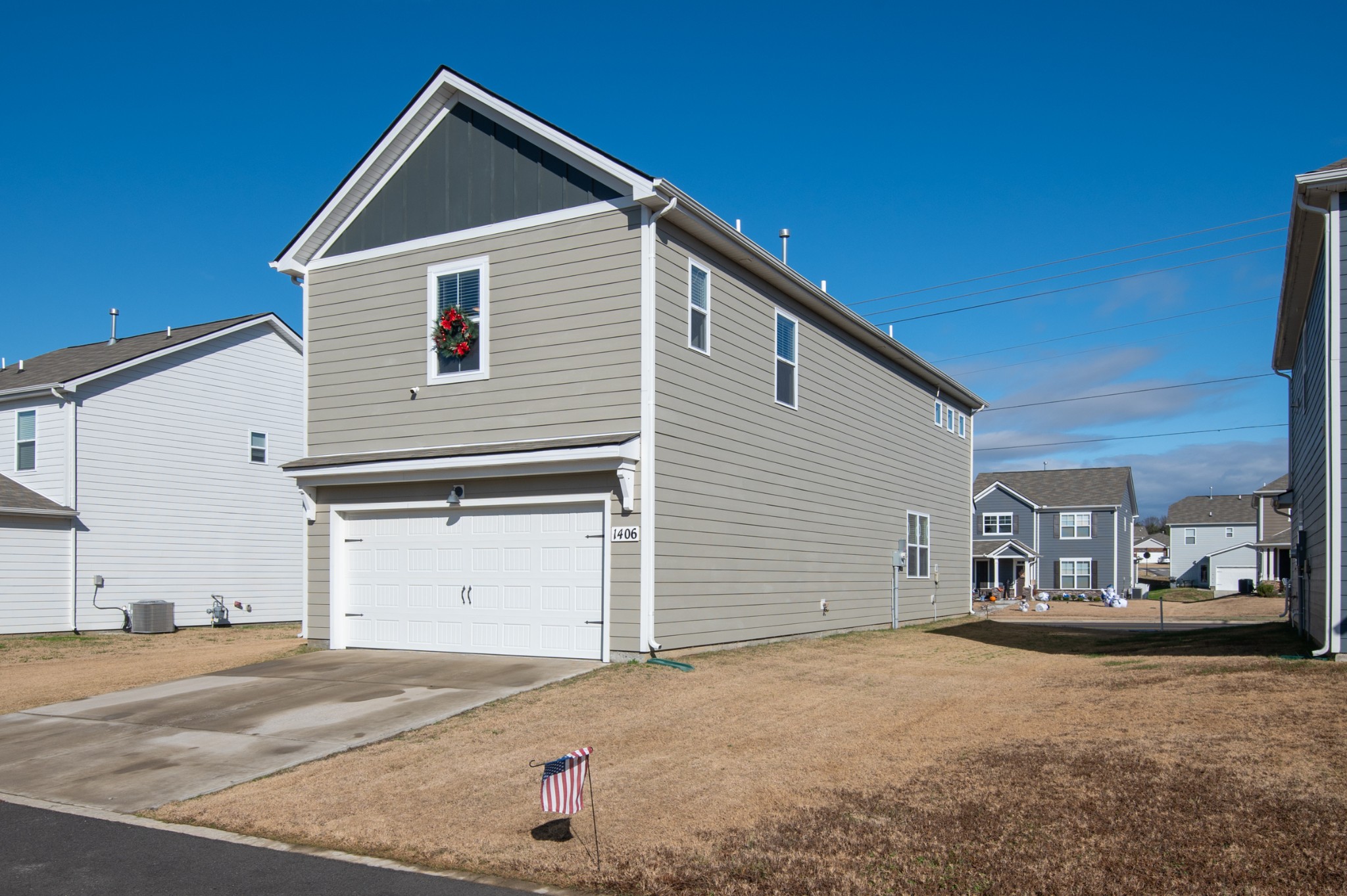 1406 Ashfield Place Lebanon, TN 37087 - Photo 4 of 23 a view of garage yard and front view of a house
