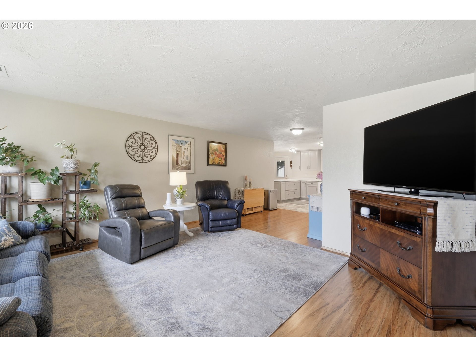 430 South 37th Place Springfield, OR 97478 - Photo 11 of 39 a living room with furniture and a flat screen tv