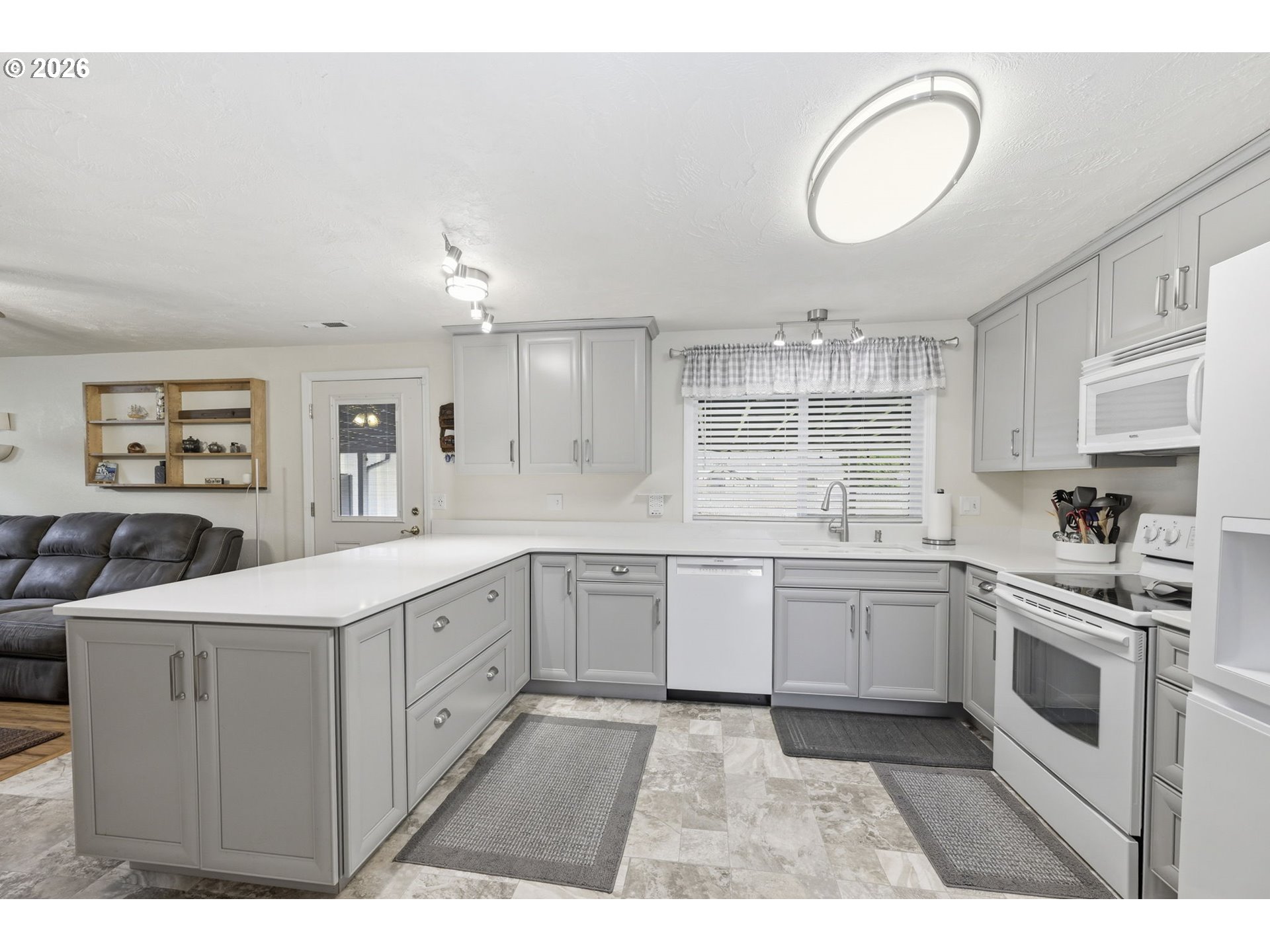 430 South 37th Place Springfield, OR 97478 - Photo 13 of 39 a kitchen with a sink stove and cabinets