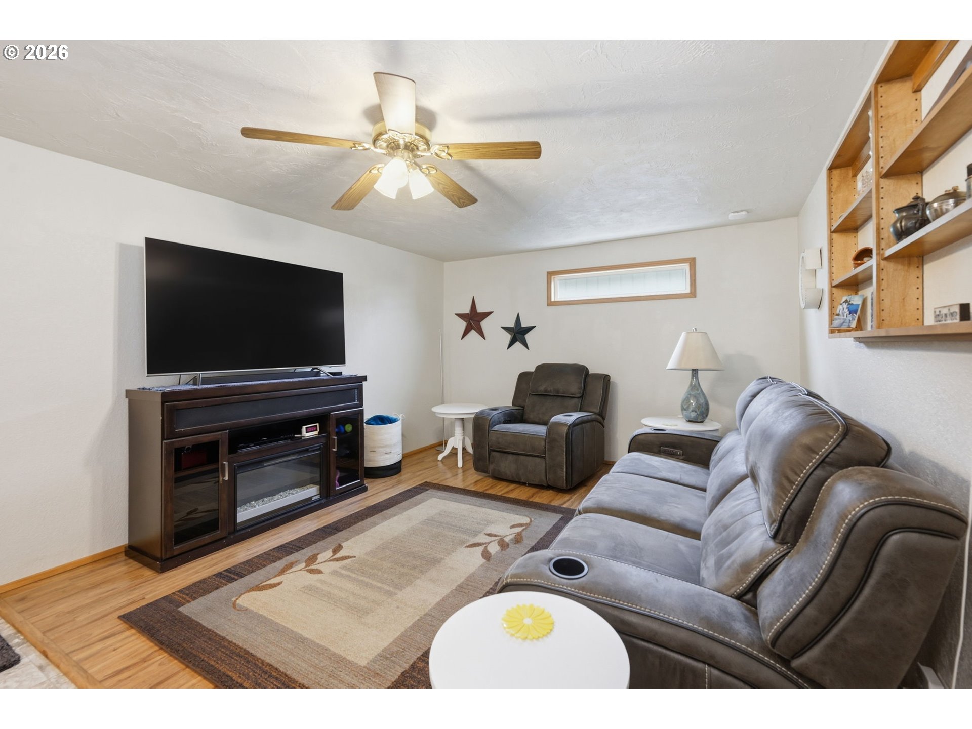 430 South 37th Place Springfield, OR 97478 - Photo 18 of 39 a living room with furniture and a flat screen tv