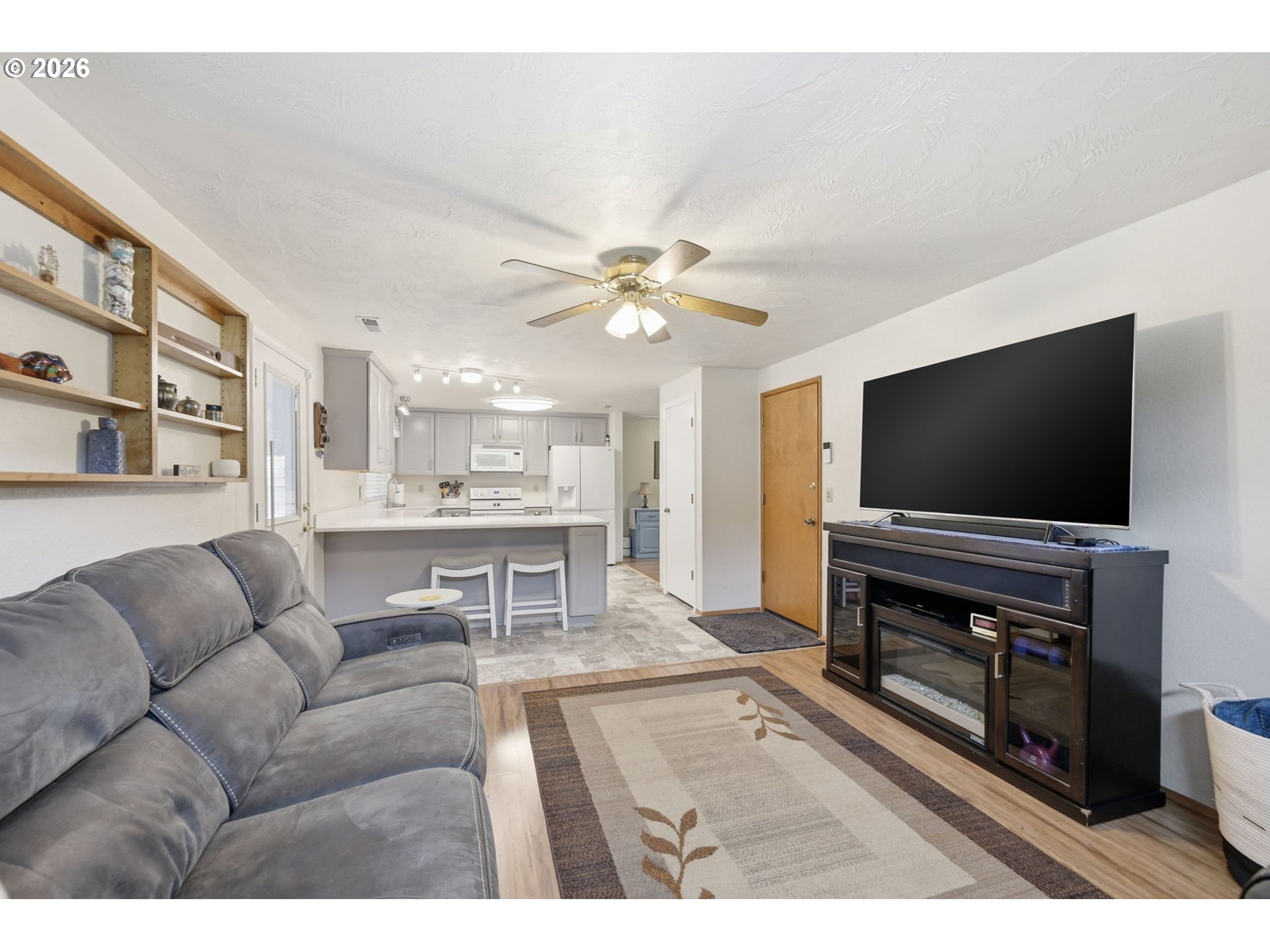 430 South 37th Place Springfield, OR 97478 - Photo 19 of 39 a living room with furniture and a flat screen tv