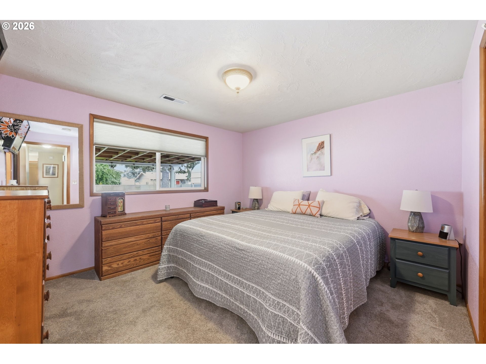 430 South 37th Place Springfield, OR 97478 - Photo 22 of 39 a bedroom with a bed a large window with the outer view