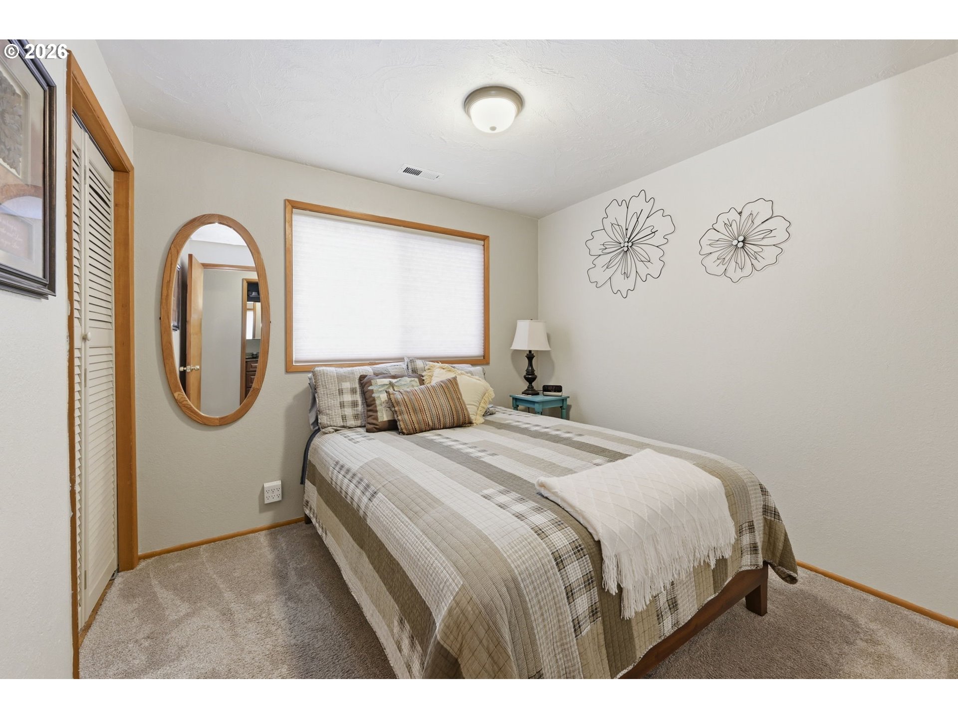 430 South 37th Place Springfield, OR 97478 - Photo 25 of 39 a bedroom with a bed and a painting on the wall